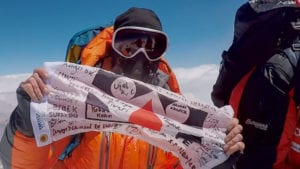 Chris on Summit with Save One Life Flag